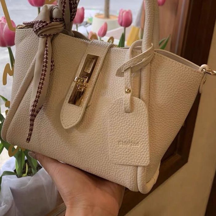 Carmine Juneberry CityEdit™ Litchi Luxe Tote with scarf handle, stylish tote bag with textured surface and elegant design.