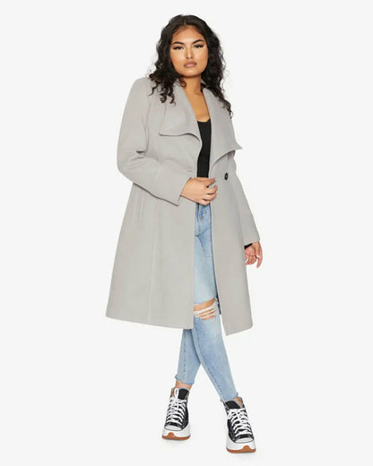 Rose Eleusis waterfall lapel double-breasted duster coat in silver, shown on a model with long sleeves and tailored fit.