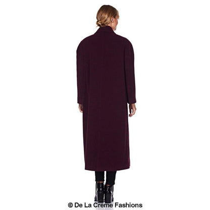 Rose Eleusis Curve wool and cashmere blend plus size long coat hanging on a rack, showcasing its tailored fit and soft fabric.