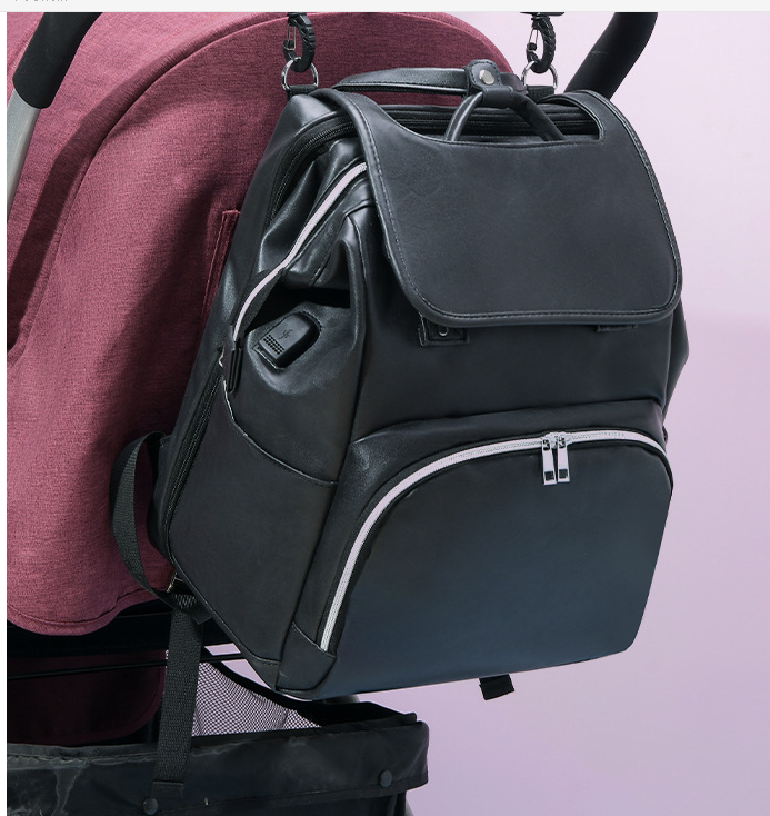 Maroon Asteria PU leather diaper bag with multiple compartments, designed for parenthood and maternity needs.