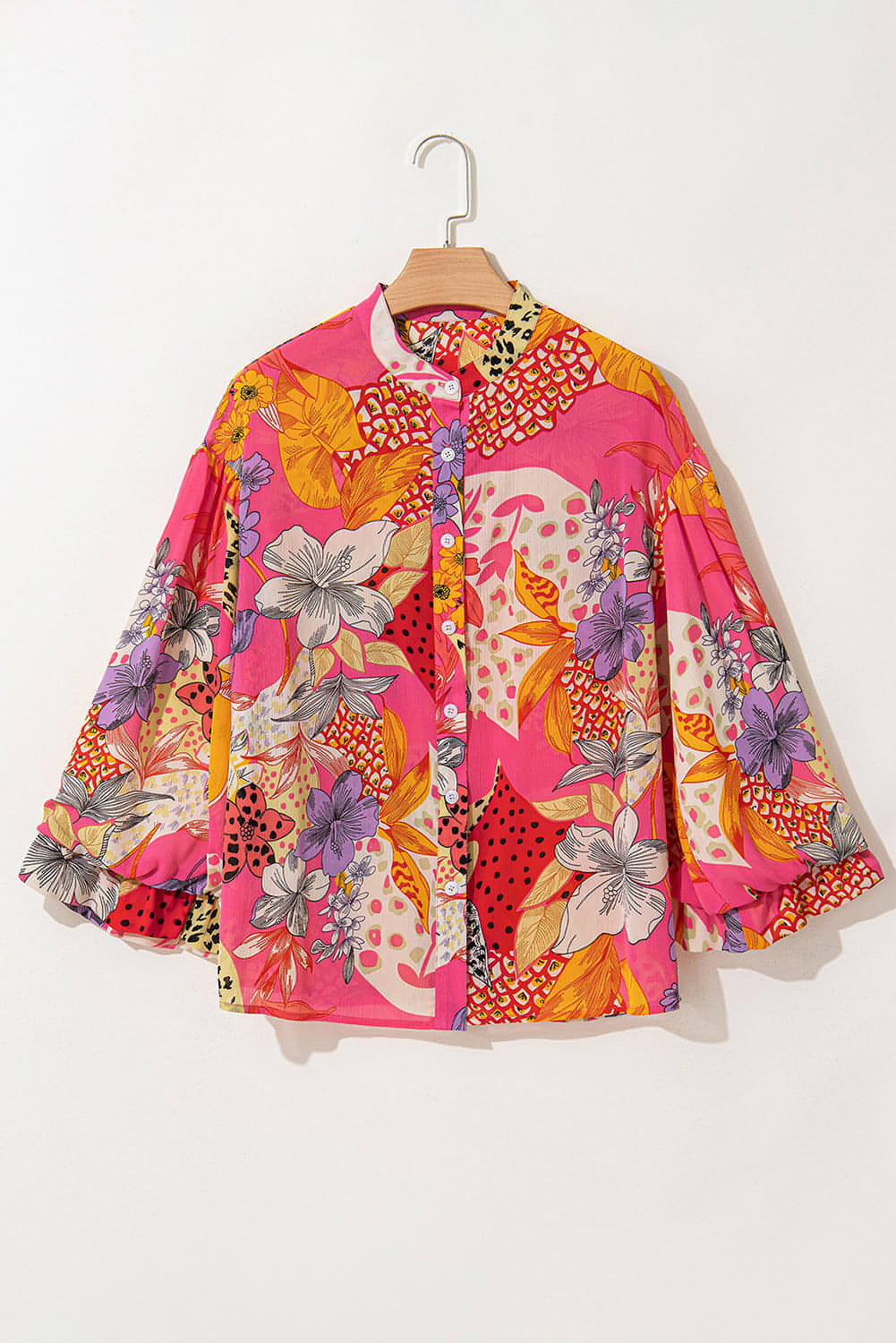 Red abstract floral print buttoned ruffled bubble sleeve blouse by Carmine Juneberry, featuring a stylish floral pattern and feminine ruffles.