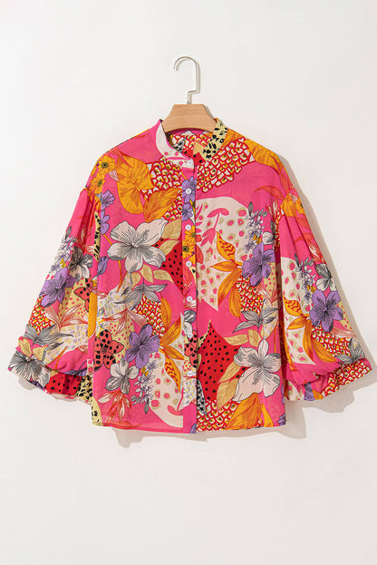 Red abstract floral print buttoned ruffled bubble sleeve blouse by Carmine Juneberry, featuring a stylish floral pattern and feminine ruffles.
