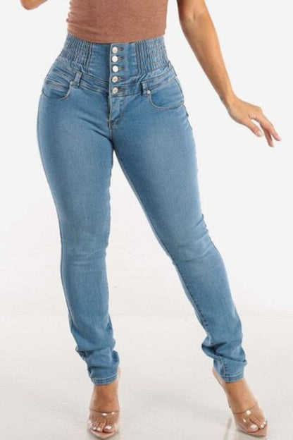 Taupe Oliver high waist skinny jeans with button details, designed to lift hips and enhance curves, shown on a model.