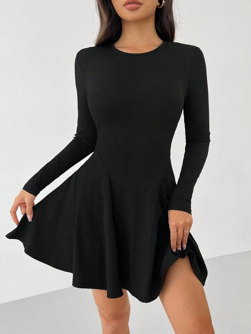 Green Alcestis dress featuring a stylish, flowing design with a fitted waist and elegant neckline, perfect for formal occasions.