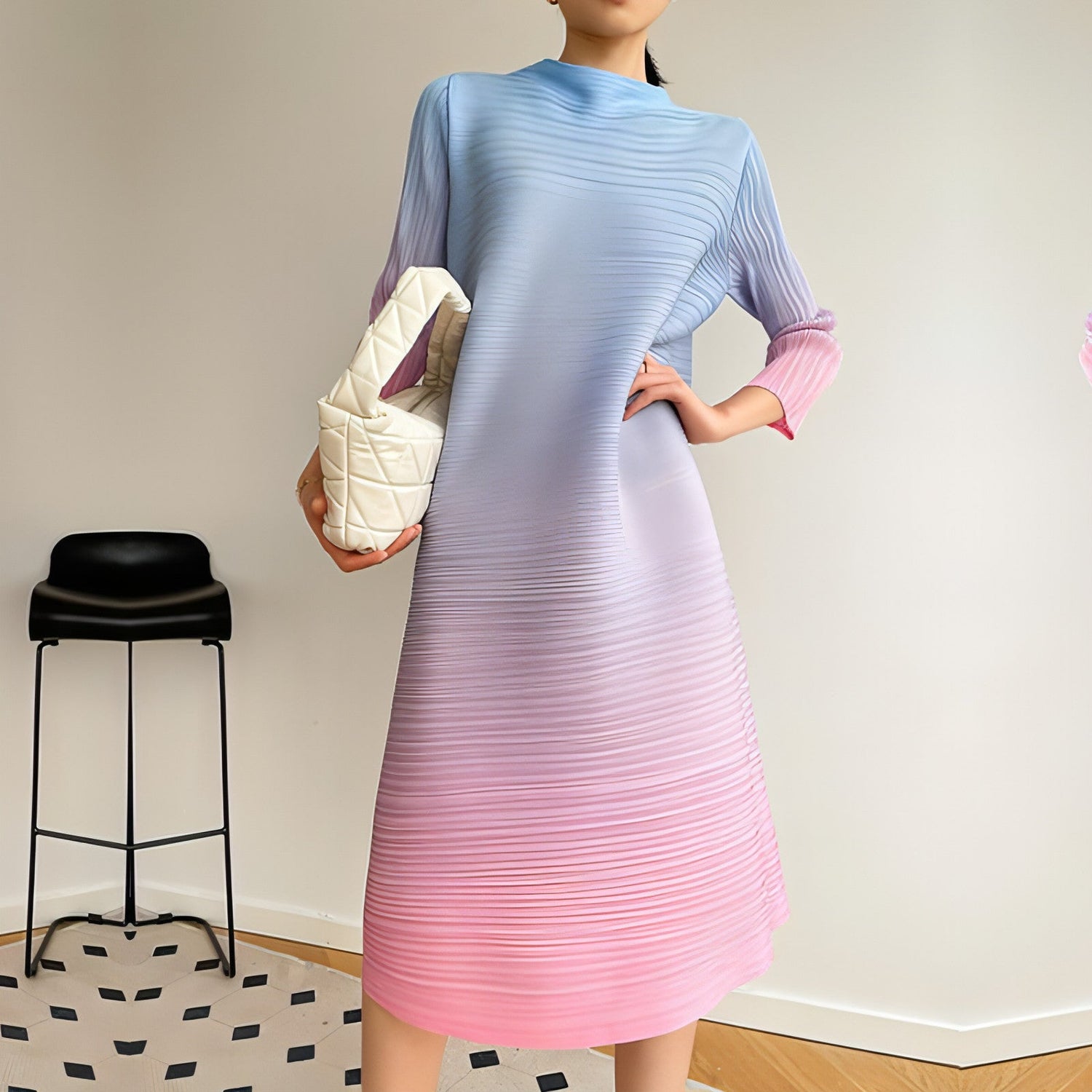 Plus size pleated dress by Carmine Juneberry featuring a flowy silhouette and elegant design for women.