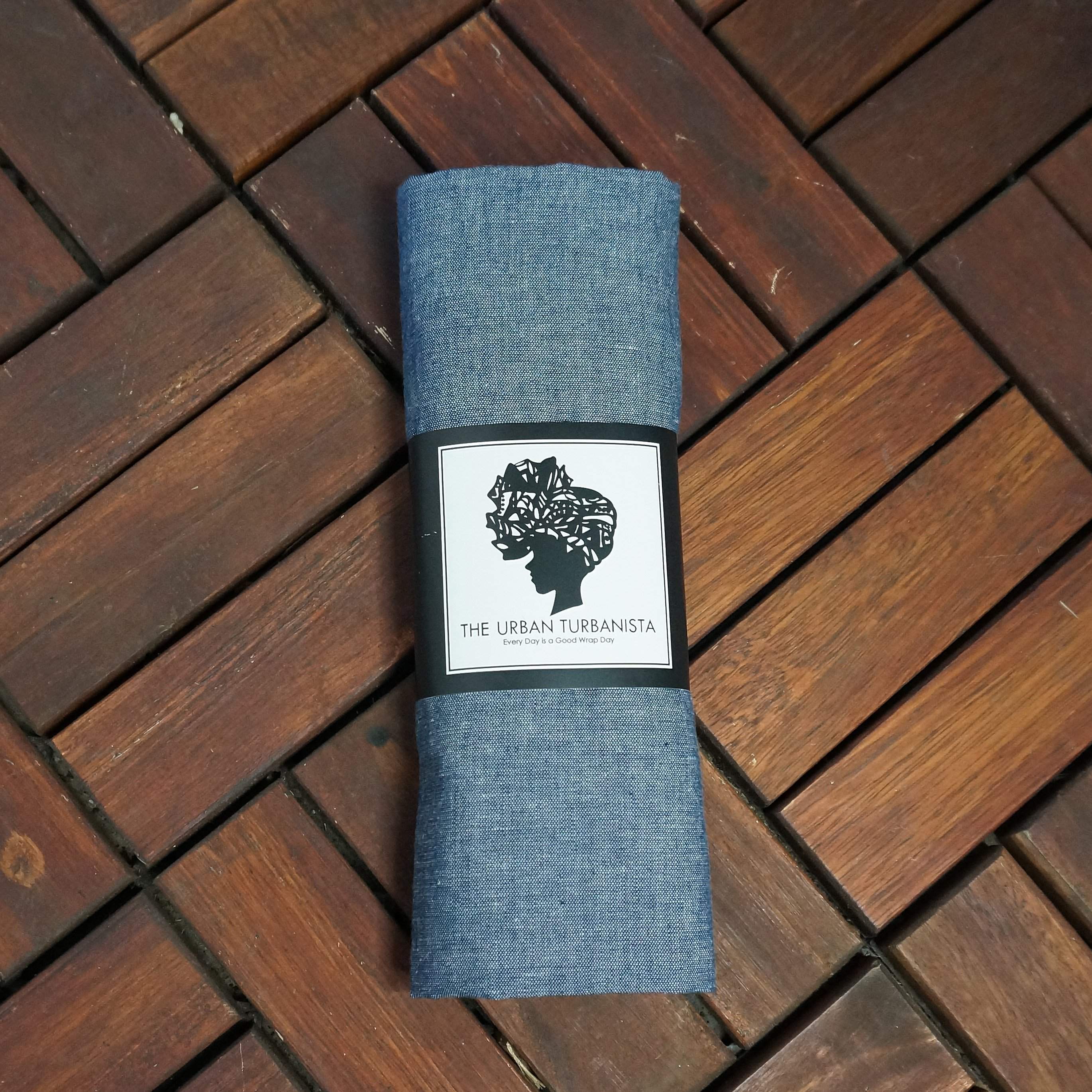 Denim chambray headwrap from Amaranth Phanes, stylish scarf accessory with knot detail on soft fabric.