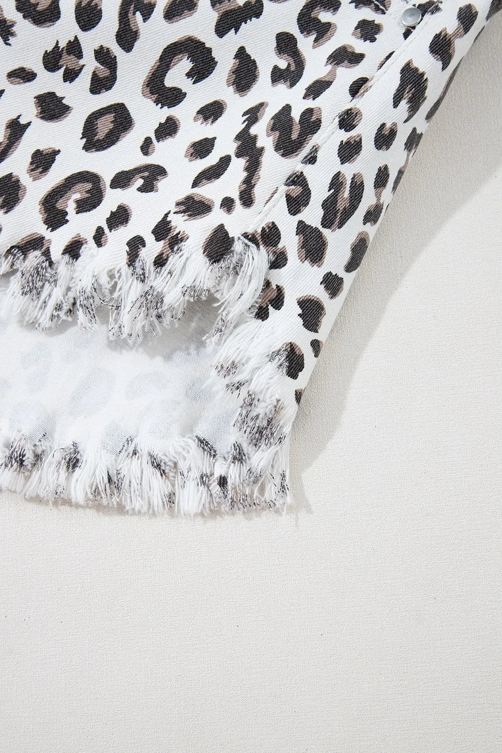 Leopard print frayed hem denim shorts for women by Ruby Styx, featuring distressed edges and a trendy, casual style.
