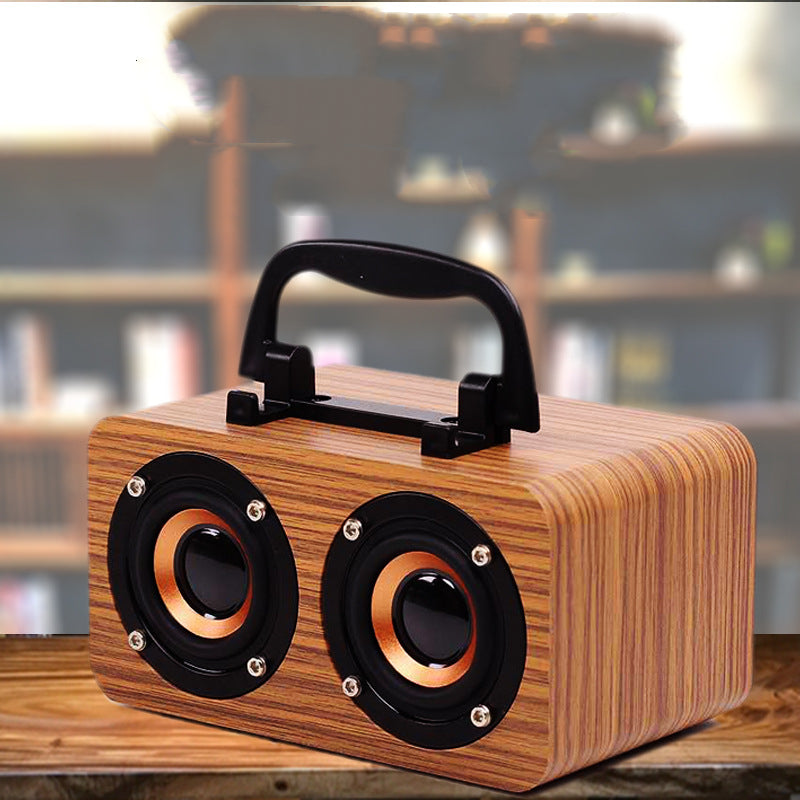 Maroon Asteria wooden wireless Bluetooth speaker for outdoor use, portable audio device with rugged wooden casing.