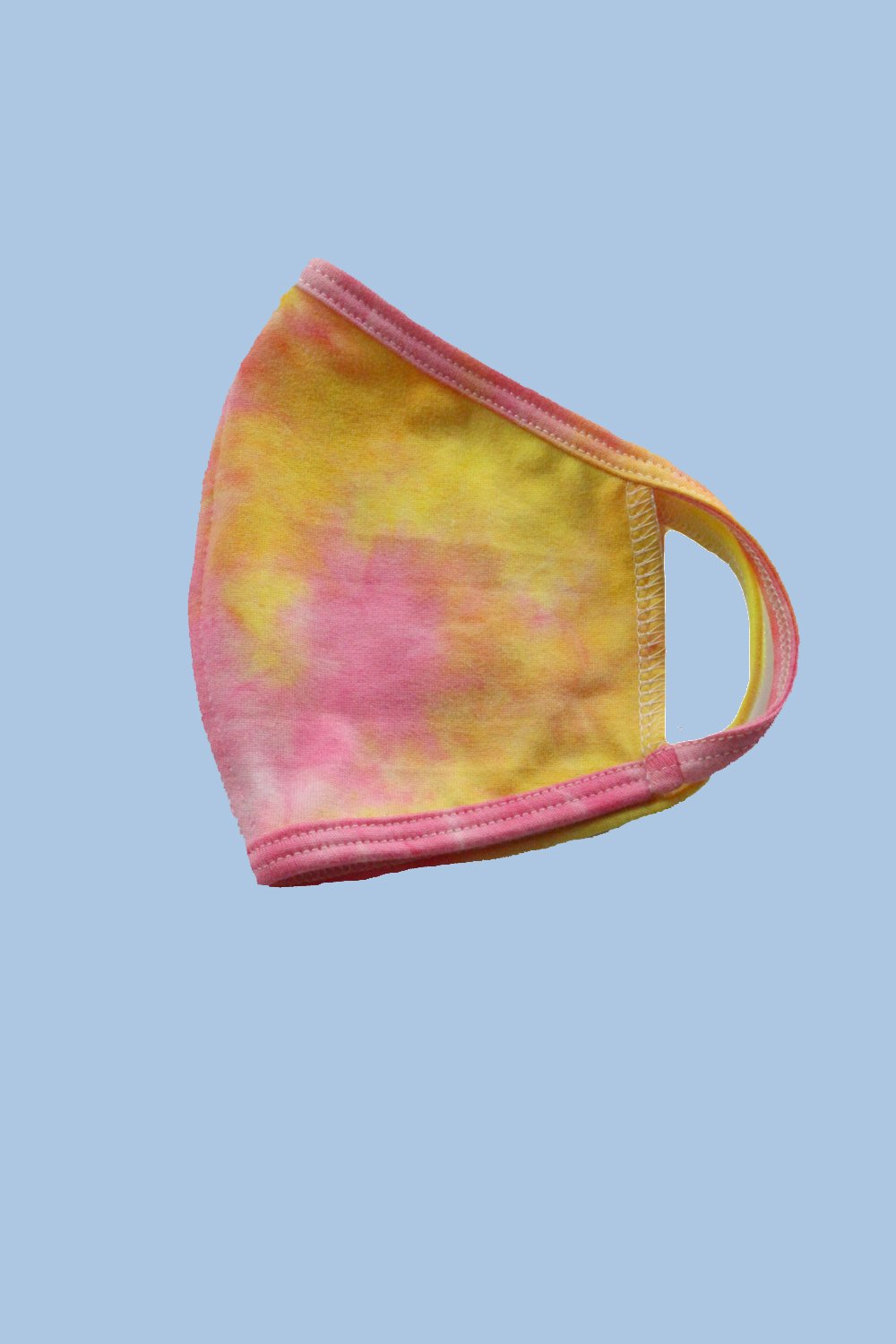 Kids reusable cloth face mask by Indigo Arrowwood, designed for children, featuring colorful patterns and comfortable fit.