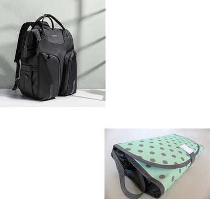 Carmine Juneberry SmartMom Travel+ diaper backpack with multiple compartments and adjustable straps, designed for moms on the go.