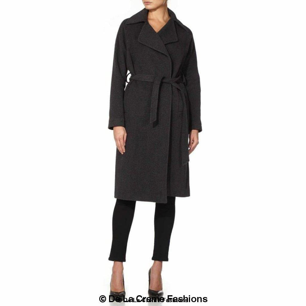 Grey Rose Eleusis Diana wrap-around duster coat hanging on a wooden hanger, showcasing its long, flowing design and lightweight fabric.