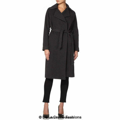 Grey Rose Eleusis Diana wrap-around duster coat hanging on a wooden hanger, showcasing its long, flowing design and lightweight fabric.