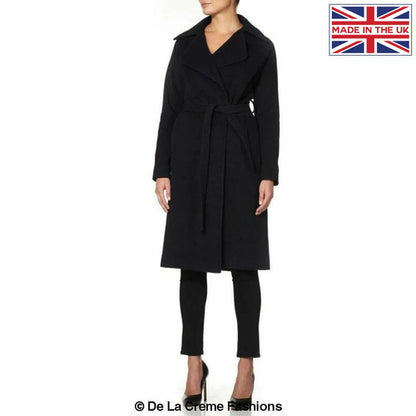 Navy Diana wrap-around duster coat by Rose Eleusis, shown on a model, featuring a stylish, flowing design and classic collar.