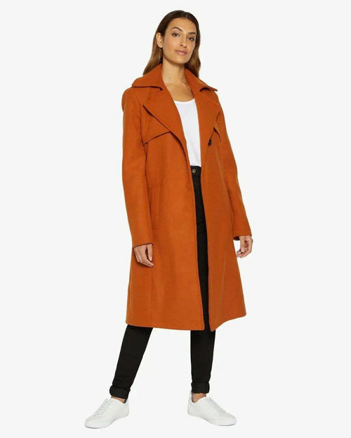 Orange Dina lapel collar duster coat with belt from Rose Eleusis, featuring a stylish long coat design and tailored fit.