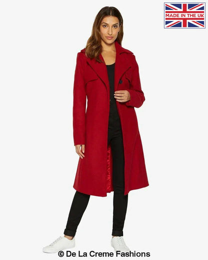 Red Dina lapel collar duster coat with belt by Rose Eleusis, shown on a model, featuring a stylish long coat with a belt.