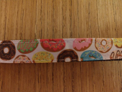 Green Thalassa small doughnut-patterned pet collar for dogs, featuring colorful doughnut designs on a comfortable collar.