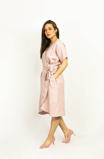 Light grey linen wrap dress by Magenta Sugarplum featuring a fitted waist and flowing skirt, perfect for casual or semi-formal wear.