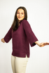 Dark plum linen oversize top from Magenta Sugarplum featuring relaxed fit and lightweight fabric with long sleeves.