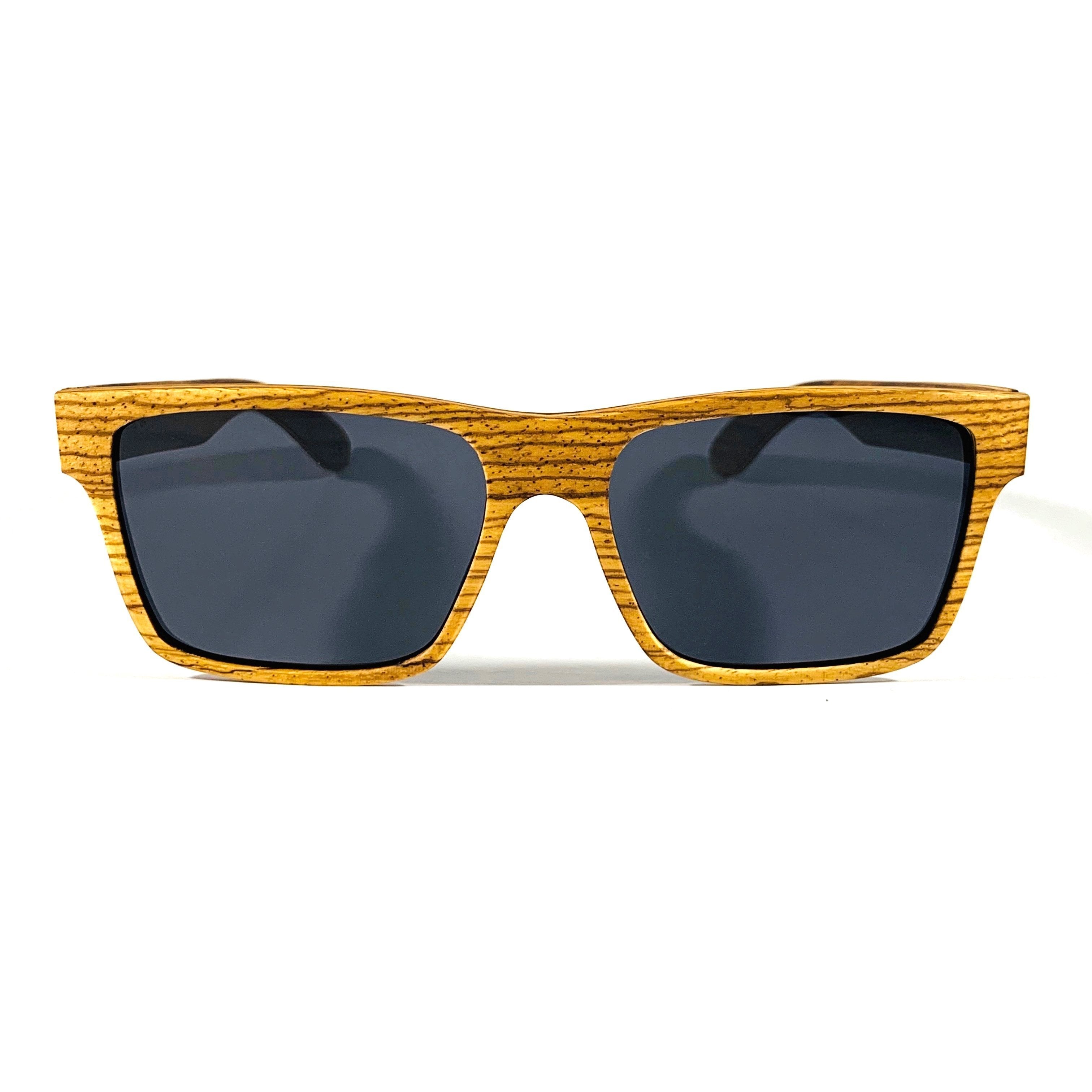 Violet Eros Druid T-shirt featuring a graphic design with sunglasses and a wooden background.