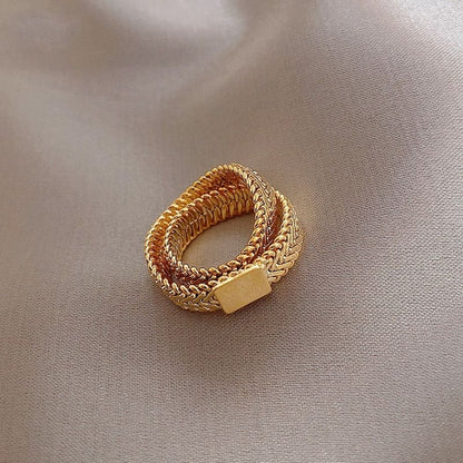 Gold snake bone chain double layer ring jewelry for women by Carmine Medusa, featuring intricate snake design and layered style.