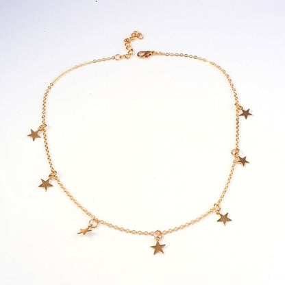 Carmine Medusa fashion pentagram pendant necklace with metal star charm on a delicate chain, stylish jewelry accessory.