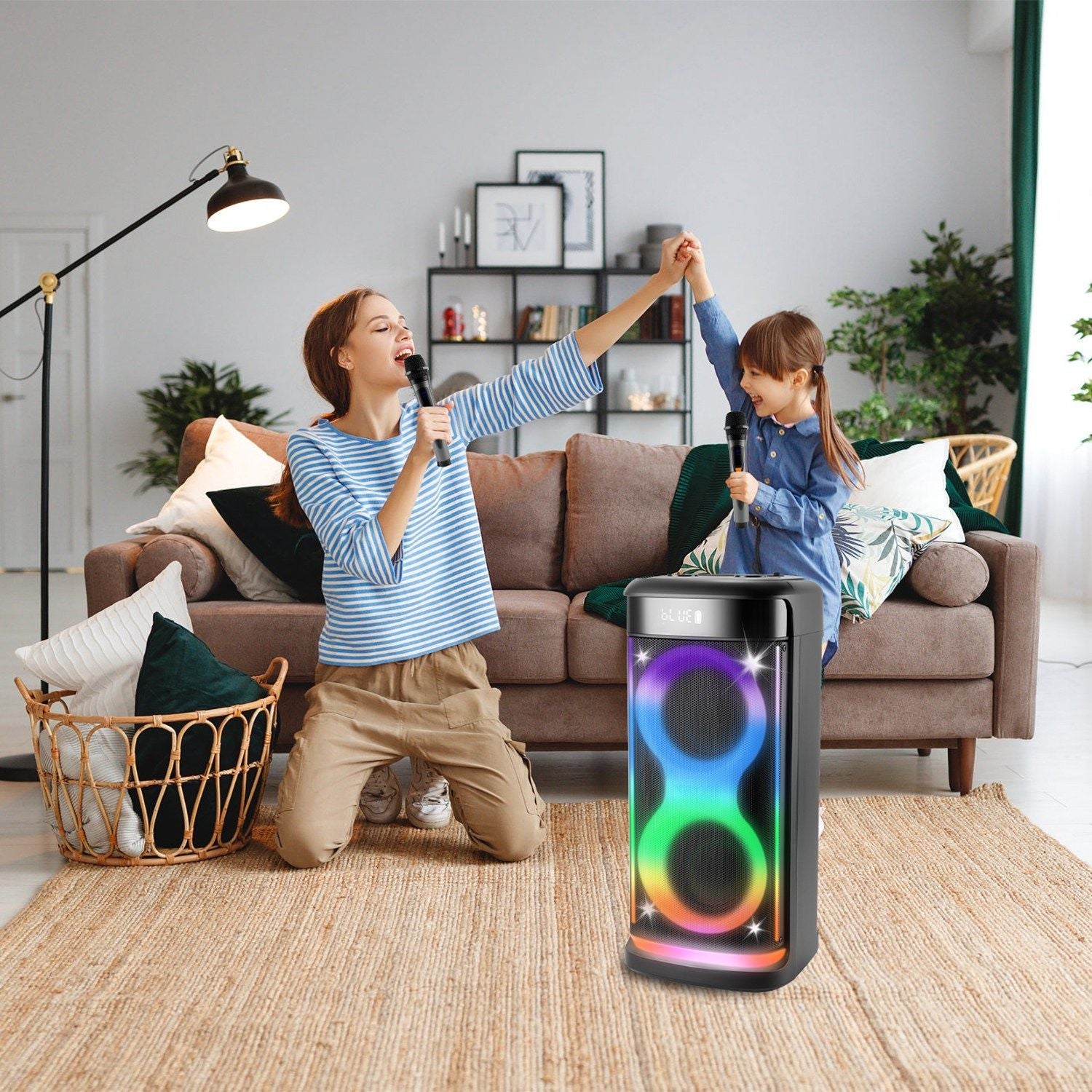 Pear Daisy portable wireless party speaker with LED light and wireless microphone, ideal for home and garden entertainment.
