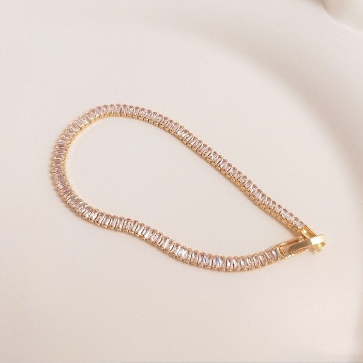 Carmine Medusa 14K gold clad rectangular T-square jewelry with zirconia stones, color-preserving finish, and elegant design.