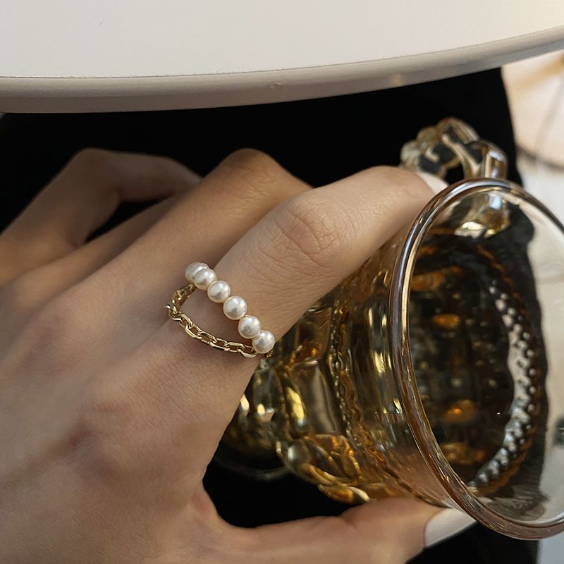 Gold Neo Gothic pearl chain opening ring by Carmine Medusa, featuring a distinctive gothic design for women&