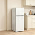 Pear Daisy portable skincare fridge for home use, compact white mini fridge with digital display for storing skincare products.