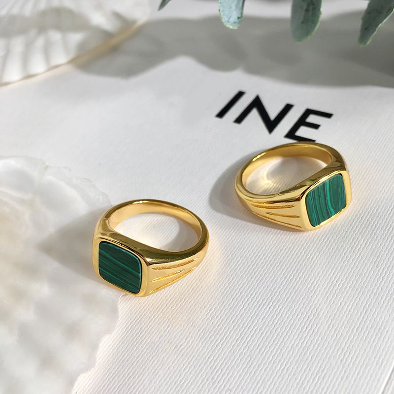 European and American retro jewelry featuring a natural green peacock stone ring by Carmine Medusa, showcasing intricate design and vibrant color.