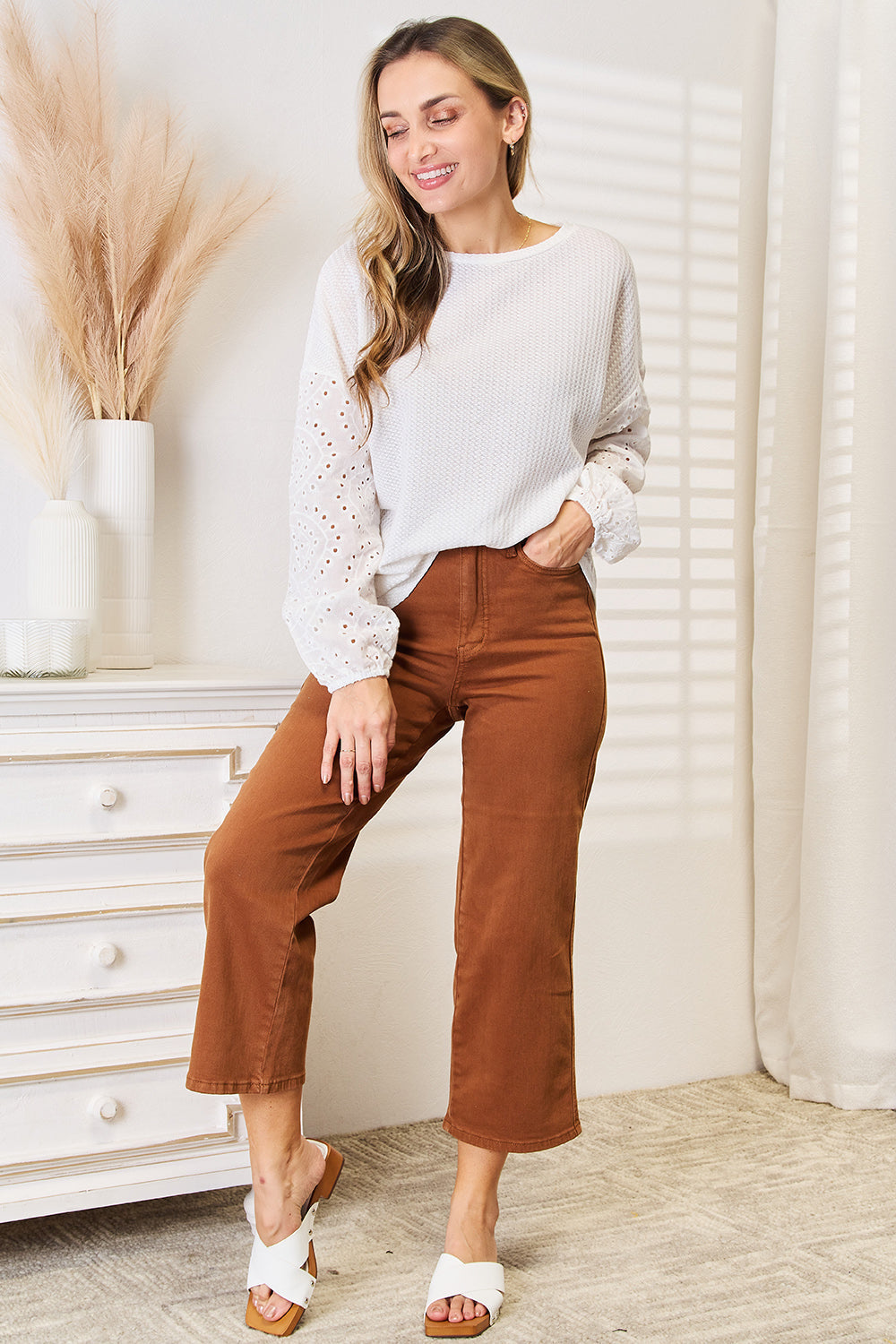 Shiny eyelet dropped shoulder round neck blouse by Pear Daisy, featuring a stylish design with eyelet details and a relaxed fit.