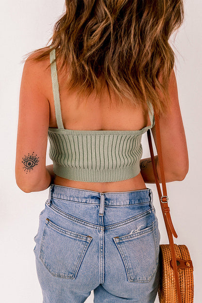 Gray ribbed spaghetti strap cropped knitted tank top by Harlequin Daisy, showcasing its fitted design and textured fabric.