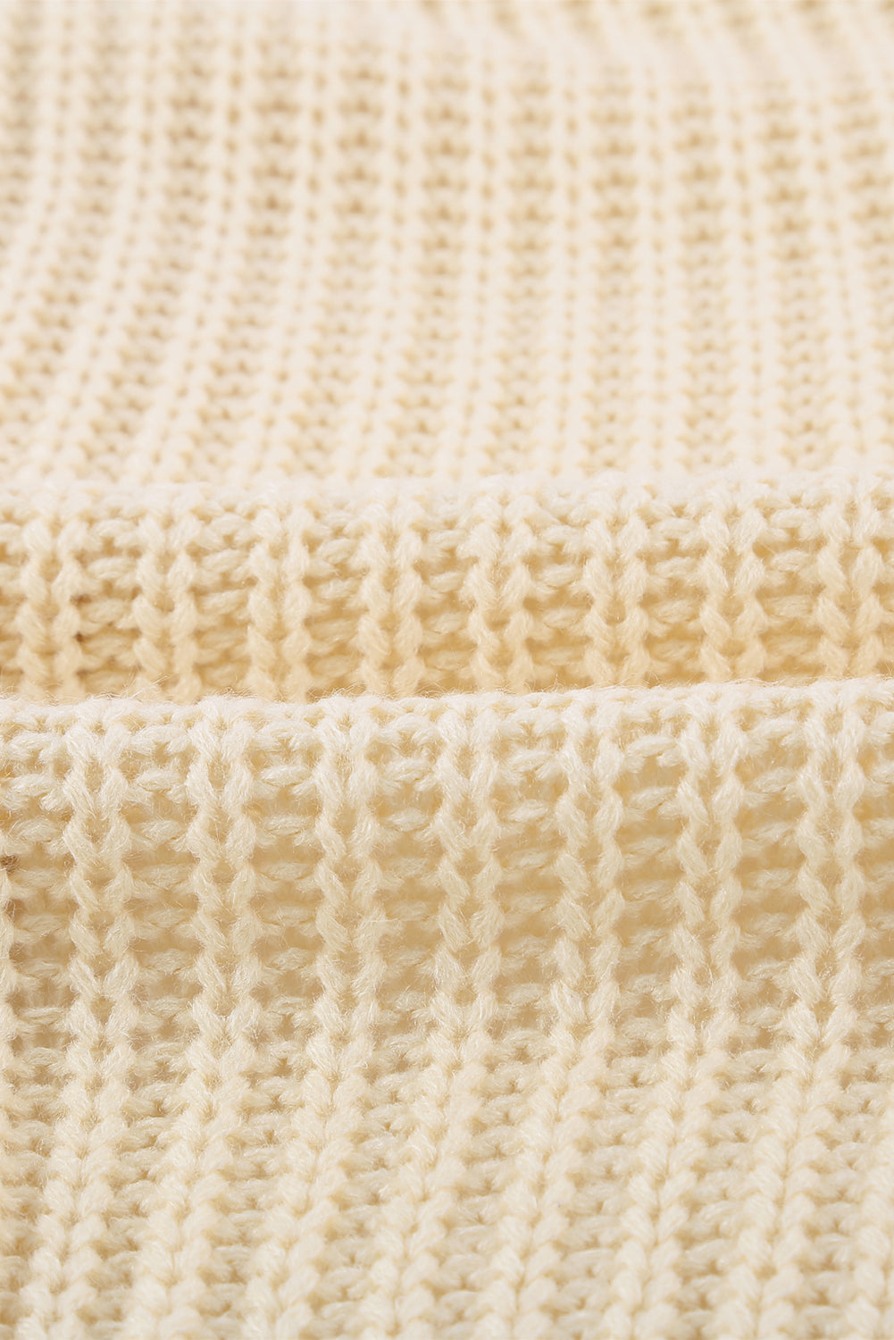 Beige wrap V-neck sweater with side tie from Harlequin Daisy, showcasing soft knit fabric and stylish design.
