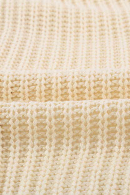 Beige wrap V-neck sweater with side tie from Harlequin Daisy, showcasing soft knit fabric and stylish design.