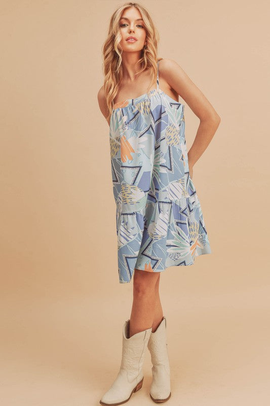 Aemi + Co printed ruffled hem square neck mini cami dress by Jade Icarus, featuring a floral print and ruffled hem detail.
