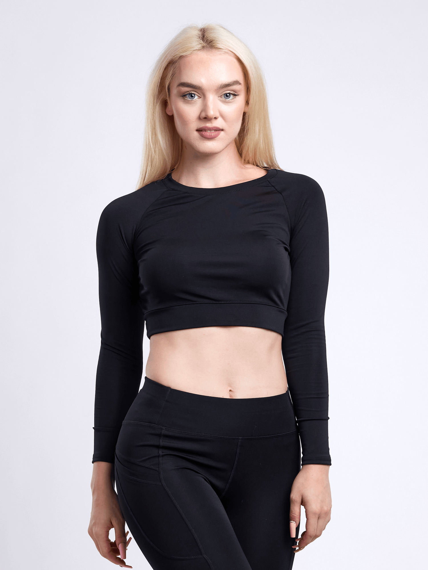 Black Lavender JupiterGear long-sleeve crop top for activewear, shown on a model, with a fitted design and stylish athletic look.