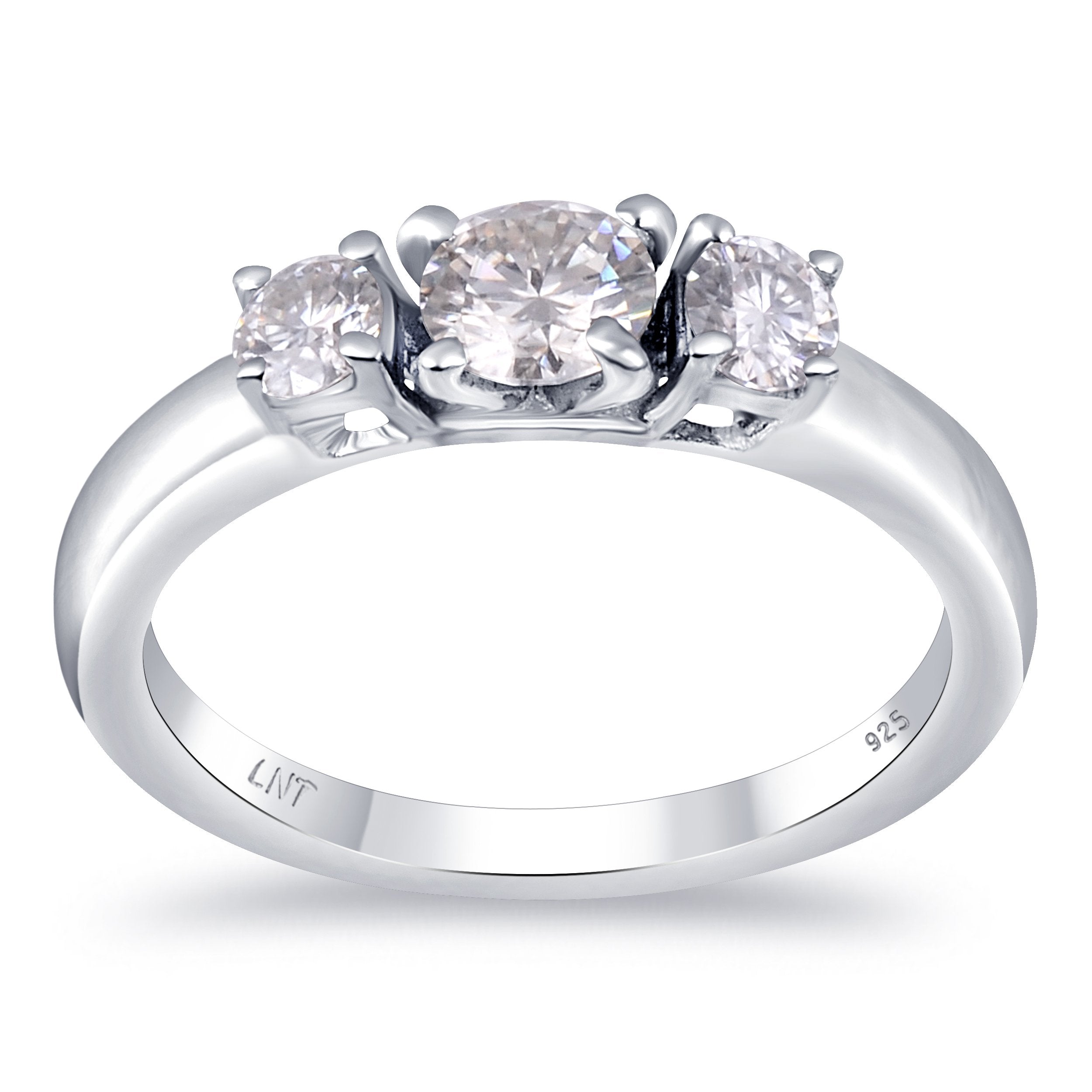 Sterling silver white moissanite 3-stone ring featuring sparkling gemstones, elegant jewelry piece from Copper Juniper