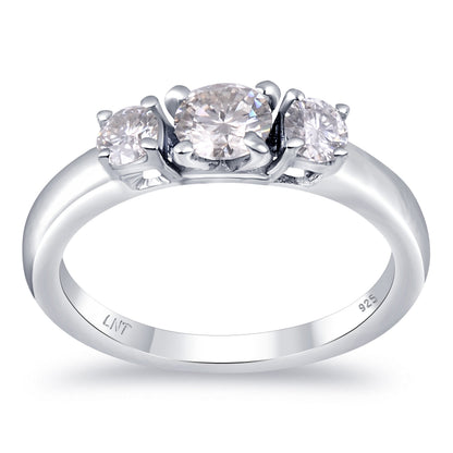 Sterling silver white moissanite 3-stone ring featuring sparkling gemstones, elegant jewelry piece from Copper Juniper