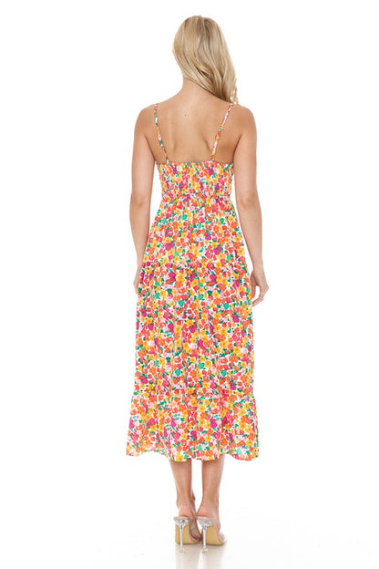 Women’s floral maxi dress by Jade Icarus featuring a flowing silhouette and vibrant flower print, perfect for summer occasions.