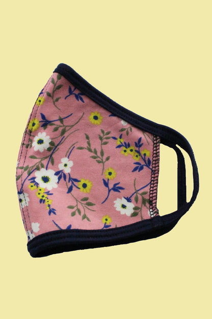 Kids reusable cloth face mask by Indigo Arrowwood, designed for children, featuring colorful, breathable fabric and comfortable fit.