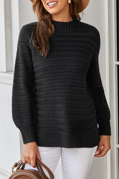 Black solid color stand collar textured sweater by Harlequin Daisy, displayed on a model with close-up of fabric details.