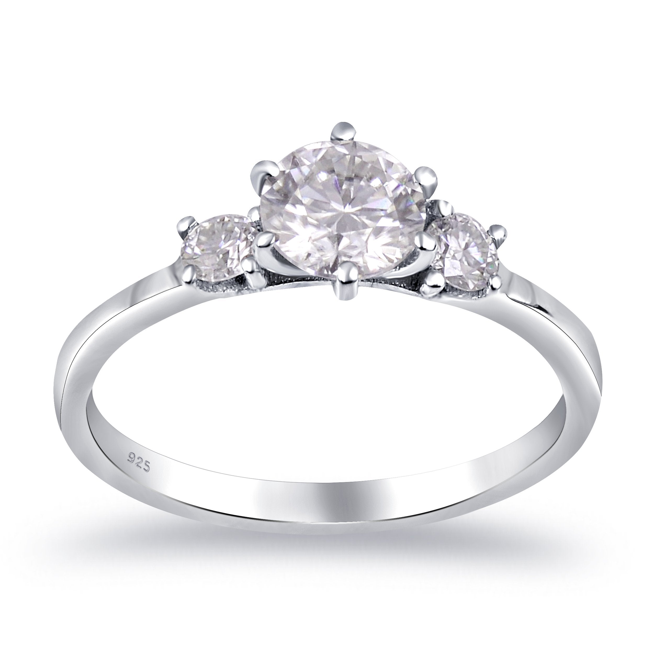 Sterling silver white moissanite 3-stone ring featuring sparkling gemstones and elegant design, crafted by Copper Juniper.