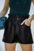 Black faux leather paper bag waist high-rise shorts by Carmine Juneberry, featuring a stylish paper bag waistband and high-rise fit.