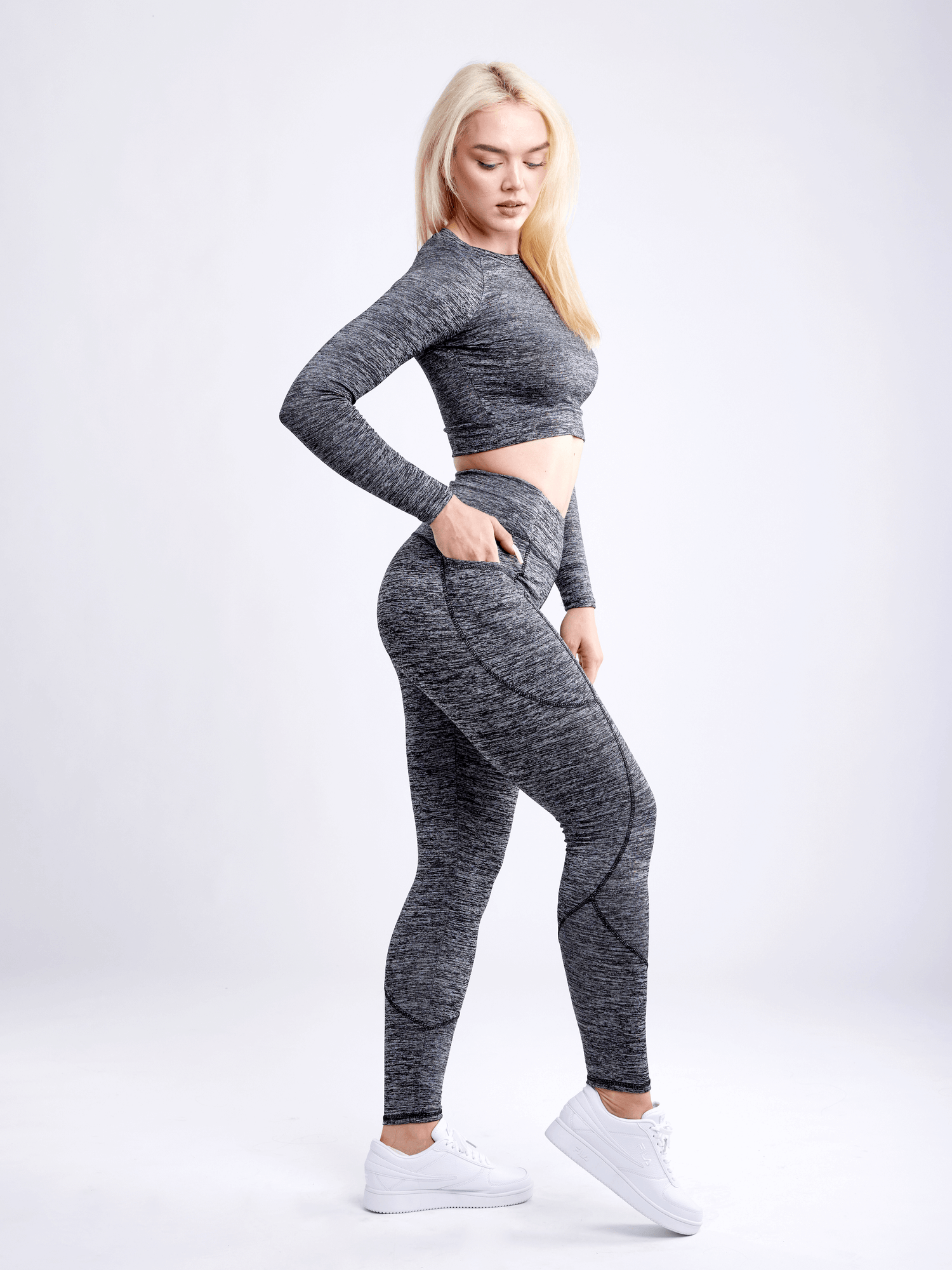 Black Lavender JupiterGear long-sleeve crop top for activewear, shown in black with a fitted design and crew neckline.