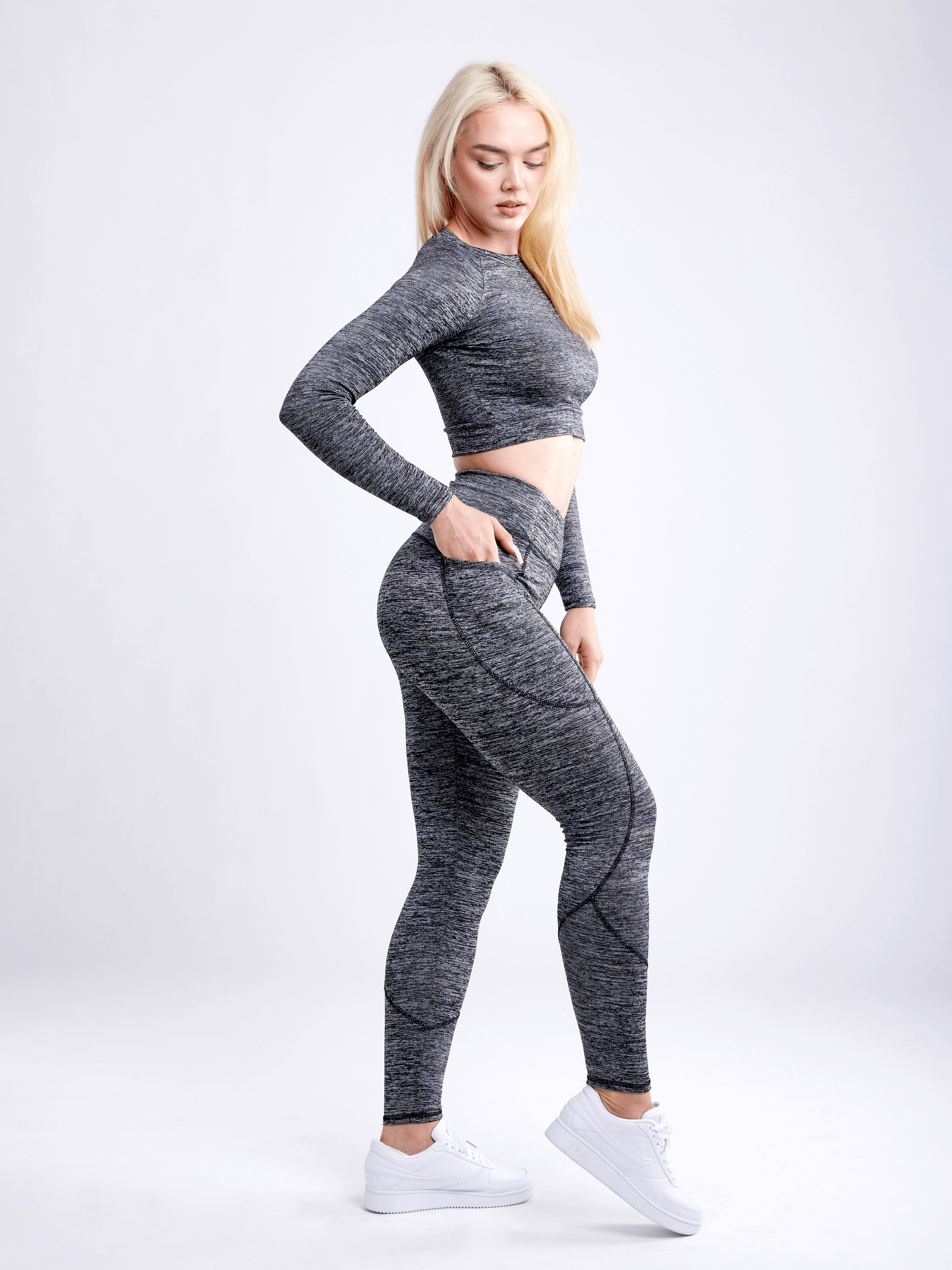 Black Lavender JupiterGear long-sleeve crop top for activewear, shown in black with a fitted design and crew neckline.