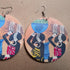Wood African women earrings by White Baobab, traditional dangle earrings with ethnic African design and handcrafted details.