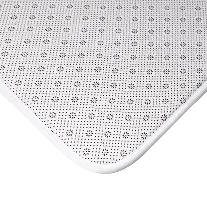 Yellow Pandora Waves bath mat with wavy textured design, placed on a bathroom floor for non-slip comfort and style.