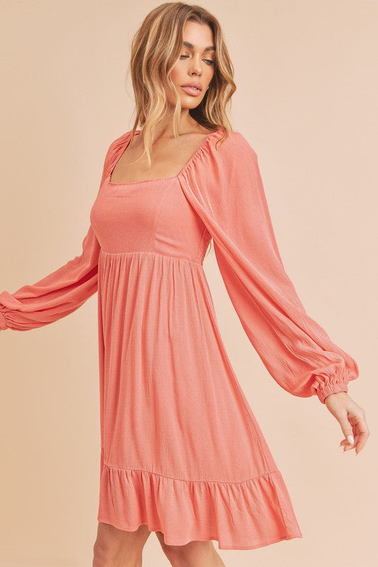 Jade Icarus Taya Dress for women featuring a stylish, flowy design with a fitted waist and elegant neckline.