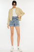 Image of Jade Icarus automotive model showcasing Kancan ultra high rise paperbag denim shorts.