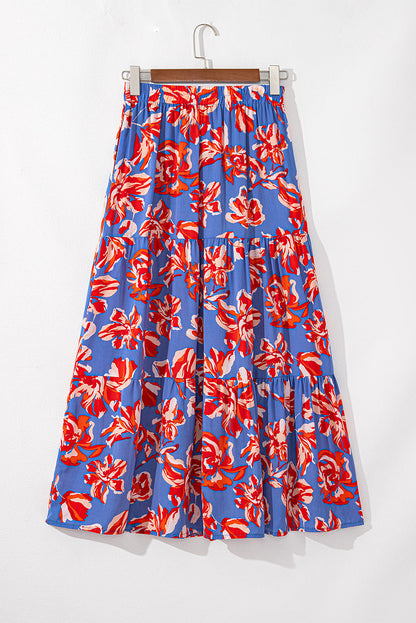 Women’s Bohemian floral tiered maxi skirt with split by Byzantium Bay, featuring flowing fabric and vibrant floral patterns.